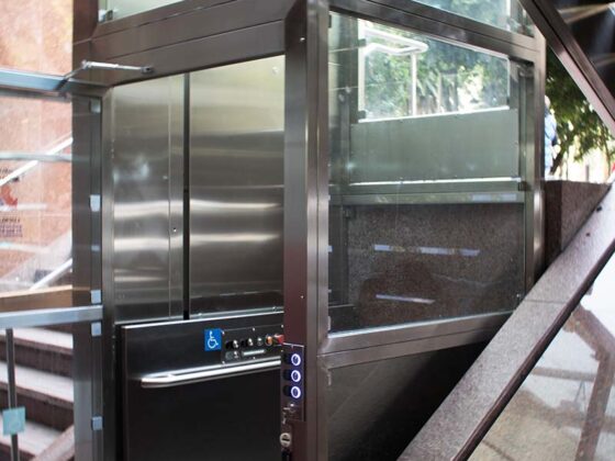 V-1504 Lux with a stainless steel cab and frame with glass enclosure and door inserts